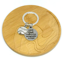 Load image into Gallery viewer, "A great Coach is hard to find and impossible to forget" Keychain