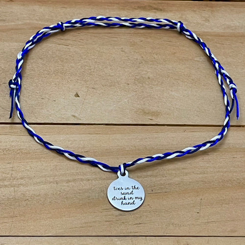 “Toes in the sand drink in my hand