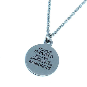 “Survived the Storms” Double-Sided Charm Necklace (Stainless Steel)